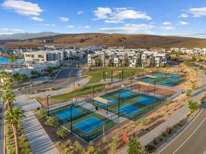 Aerial perspective of suburban area featuring a mountainous background