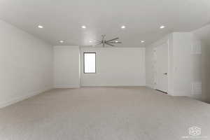 Empty room with light colored carpet, recessed lighting, and a ceiling fan