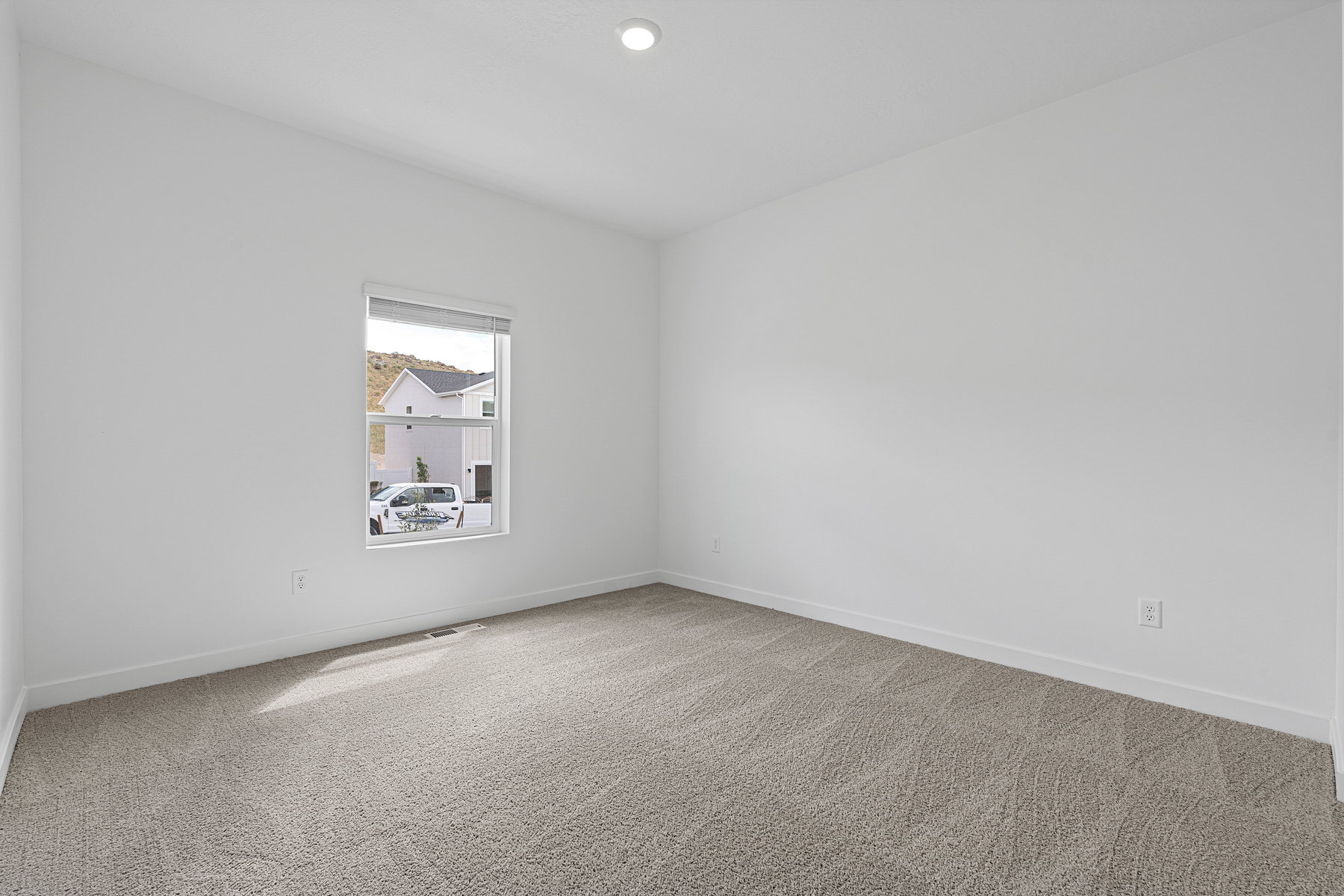 Unfurnished room featuring light colored carpet and recessed lighting
