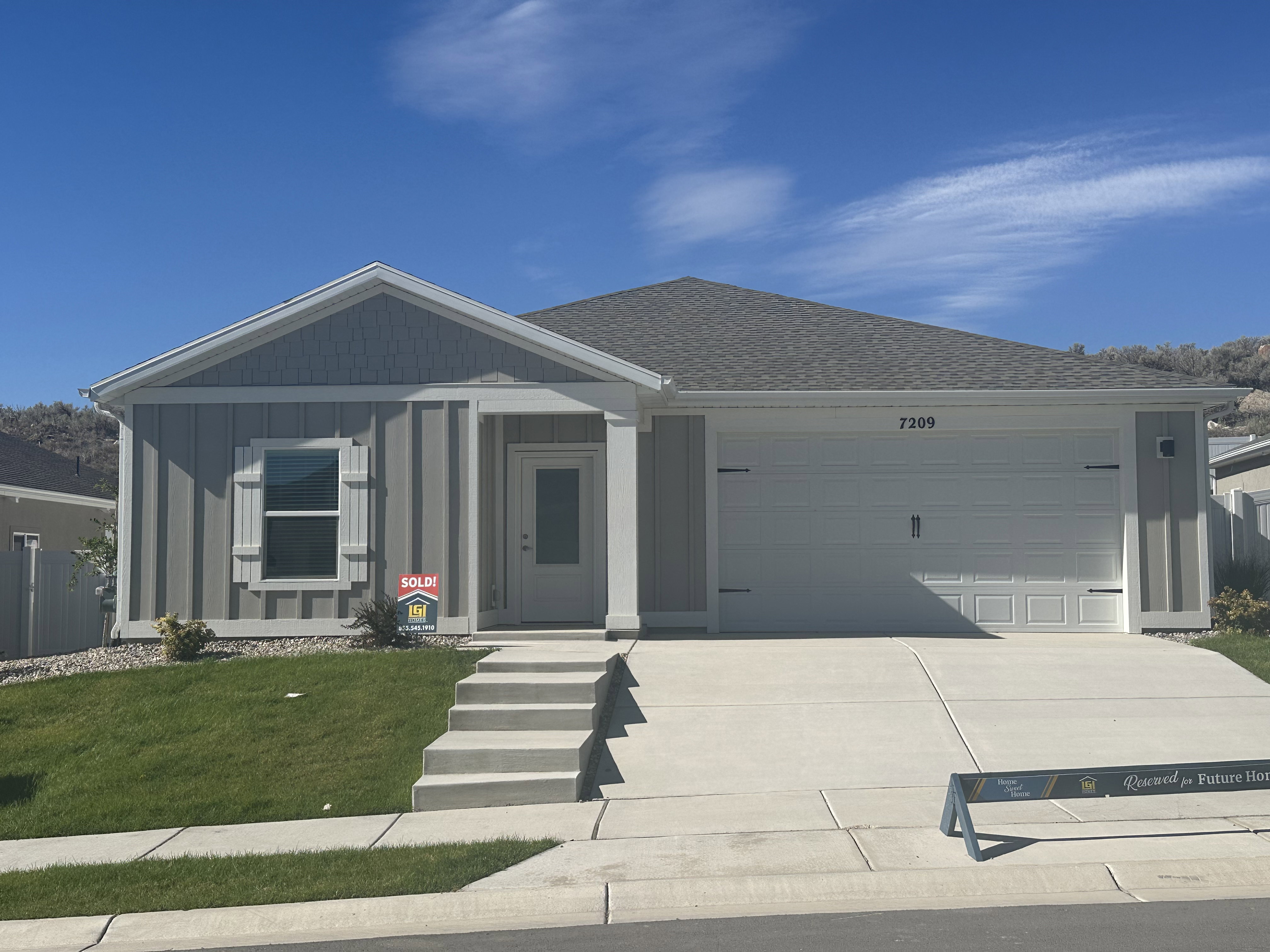 Ranch-style house featuring concrete driveway, a garage, board and batten siding, a shingled roof, and a porch