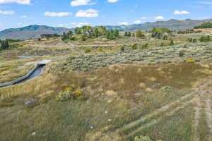 View of mountain backdrop featuring rural landscape