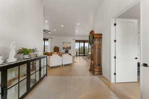 Hallway with recessed lighting and light wood finished floors