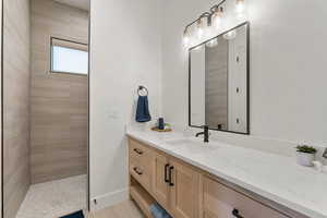 Full bathroom featuring vanity and a walk in shower