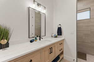 Full bathroom featuring vanity and walk in shower