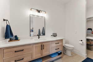 Full bath with vanity and toilet