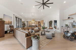Living area featuring recessed lighting, light wood-style flooring, and a ceiling fan