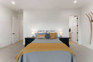 Bedroom featuring recessed lighting and light carpet