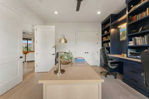 Office featuring light wood-style flooring, recessed lighting, and a ceiling fan
