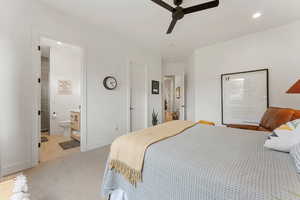 Bedroom with recessed lighting, light colored carpet, and a ceiling fan