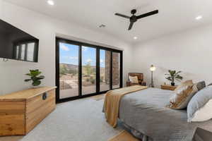 Bedroom with light carpet, access to outside, a ceiling fan, recessed lighting, and a mountain view