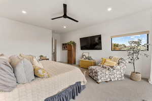 Carpeted bedroom with recessed lighting and a ceiling fan