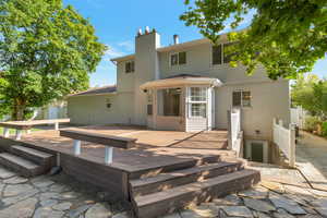 View of backyard deck and basement entrance