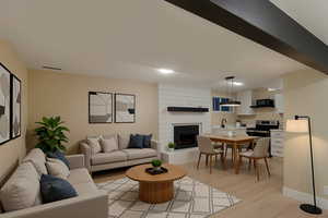 Living room with light wood-style floors and baseboards
