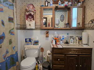 Bathroom featuring vanity and a shower with shower curtain