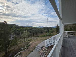 Wooden terrace featuring a mountain view