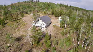 Aerial overview of property's location featuring a forest