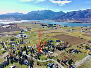 View of property location with a water and mountain view and rural landscape