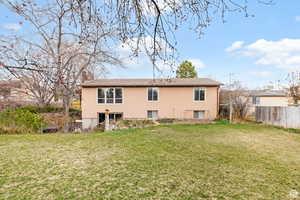 Rear view of house with stucco siding