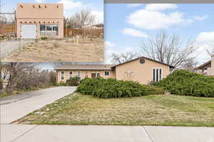 View of front of home with stucco siding and driveway