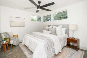 Bedroom with ceiling fan and carpet flooring