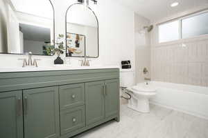 Full bath with shower / bath combination and double vanity