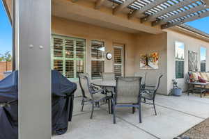 View of patio / terrace with outdoor dining area, grilling area, and a pergola