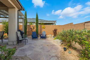 Fenced backyard featuring a patio area and a pergola