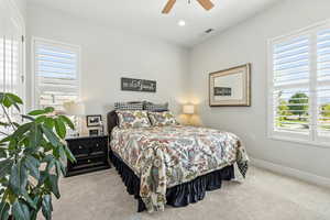 Bedroom featuring carpet flooring, recessed lighting, and a ceiling fan