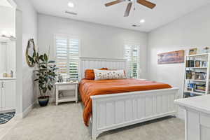 Bedroom featuring light colored carpet, recessed lighting, and a ceiling fan