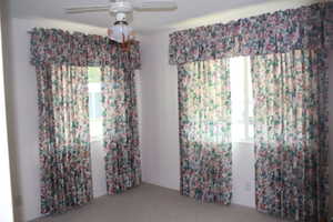 Guest room featuring a ceiling fan