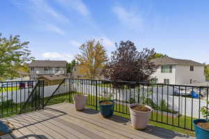 Deck featuring a lawn and a residential view