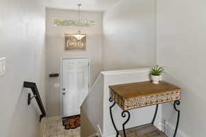 Entrance foyer featuring baseboards