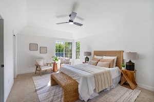 Bedroom with light carpet and a ceiling fan