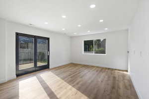 Empty room featuring recessed lighting and light wood-type flooring