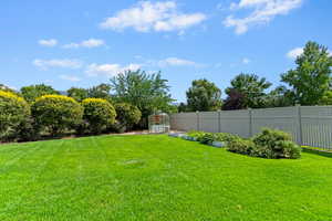 View of yard with an exterior structure and an outdoor structure