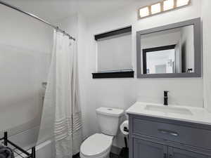 Full bathroom featuring vanity and shower / tub combo with curtain