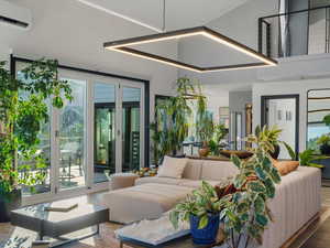 View of patio / terrace featuring an outdoor hangout area, a wall mounted AC, and french doors