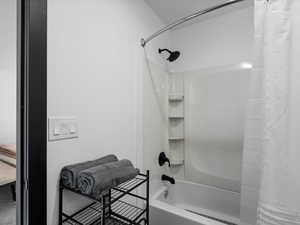 Full bath featuring shower / tub combo