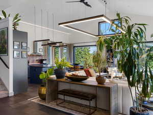 Living area featuring stairs and high vaulted ceiling