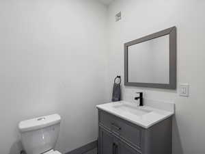 Bathroom featuring vanity and toilet