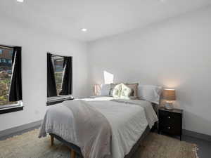 Bedroom with recessed lighting and baseboards