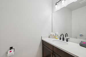 Half bath featuring vanity and toilet