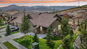 Aerial view of property and surrounding area with mountains