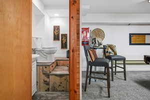 Game/Family room featuring small 1/2 bathroom