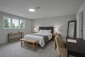 Bedroom featuring carpet and baseboards