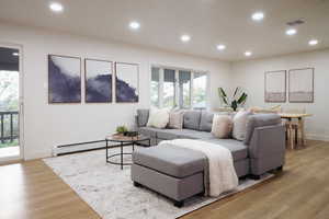 Living area featuring recessed lighting and light wood-style flooring