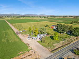 Overview of rural landscape with large plots for crops and mountains