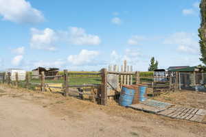 View of yard with a view of countryside and an outdoor structure