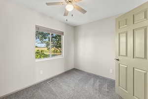 Empty room with carpet flooring