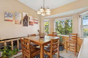 Dining room featuring plenty of natural light and a chandelier